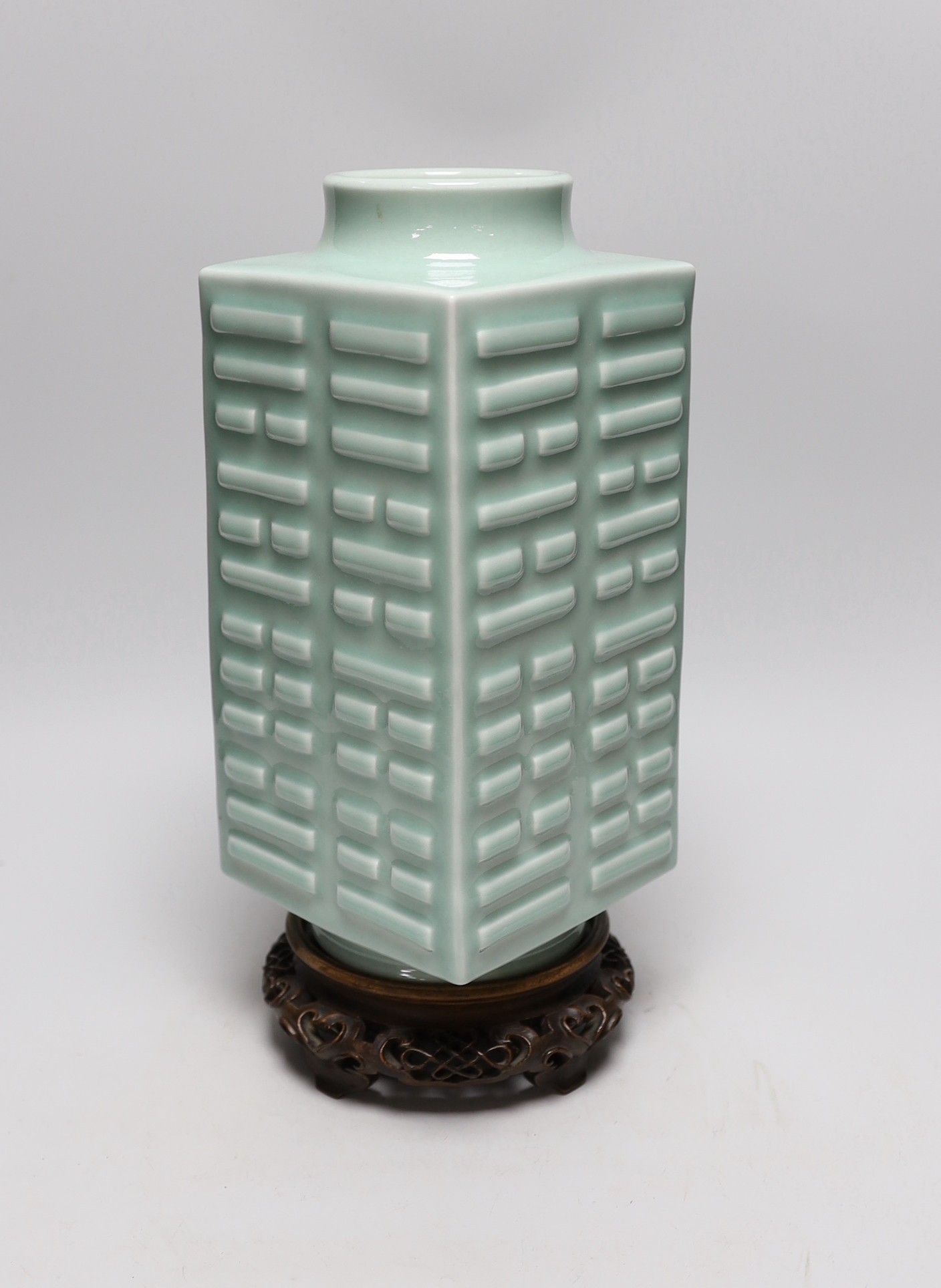 A Chinese celadon glazed eight trigrams cong vase, Guangxu mark, wood stand, 35cms high